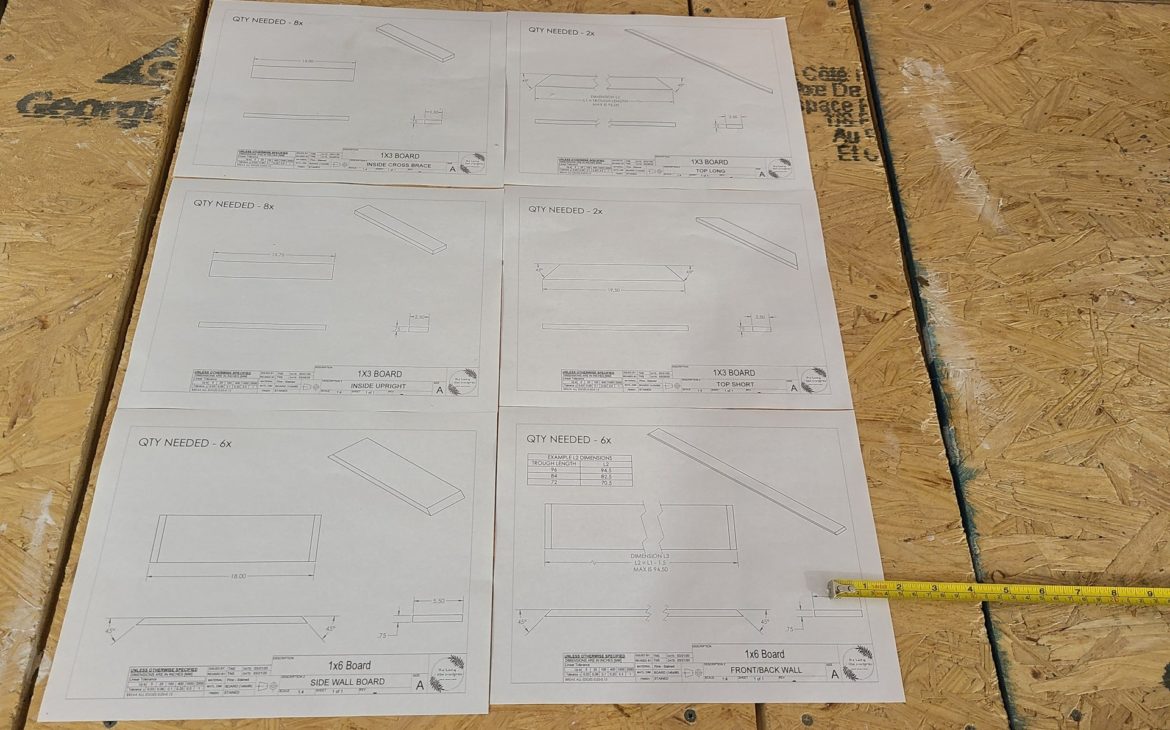 DIY planter box drawing package sheets laying on workbench