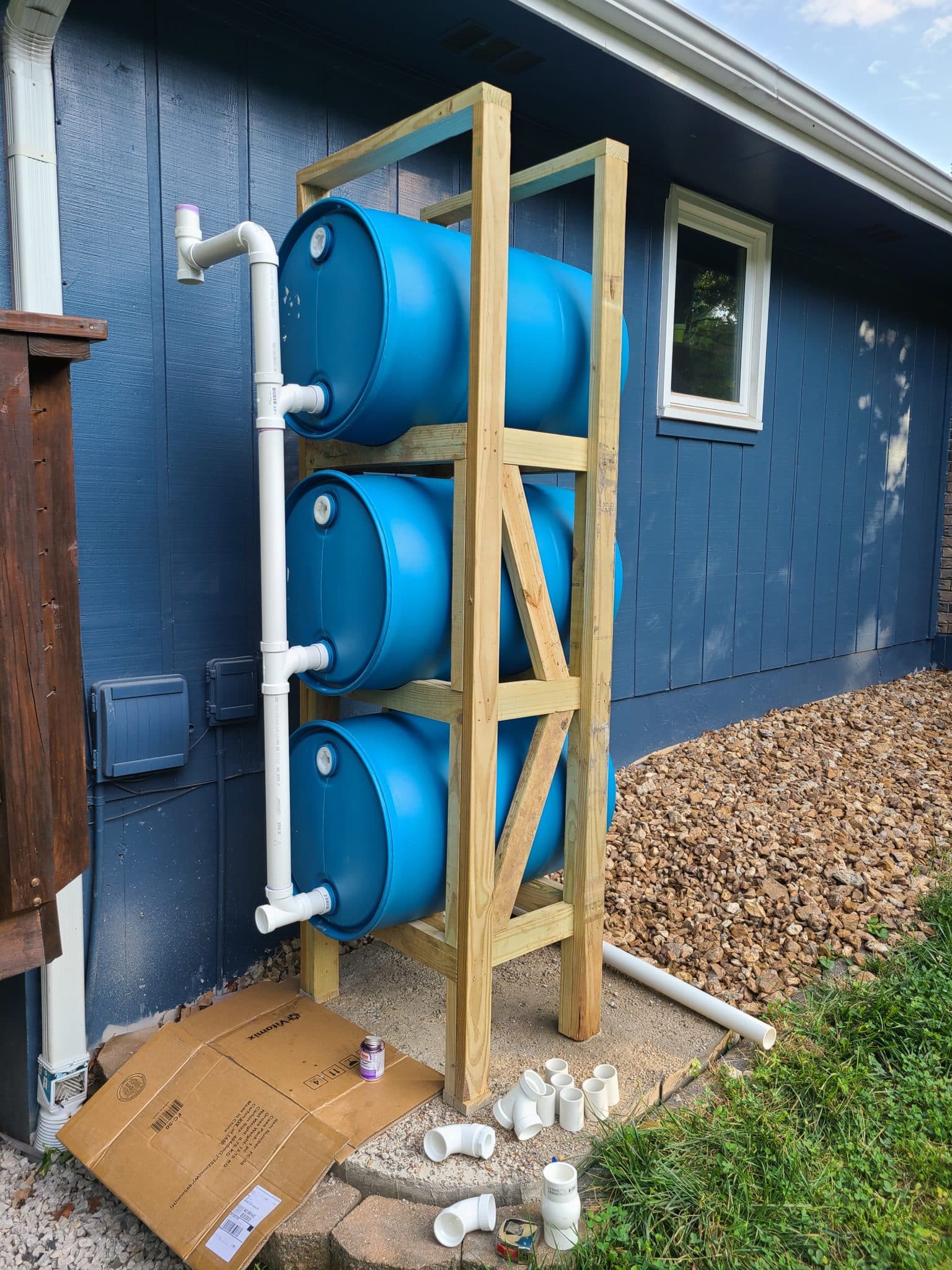 beginning assemble of vertical plumbing for stacked rain barrel system