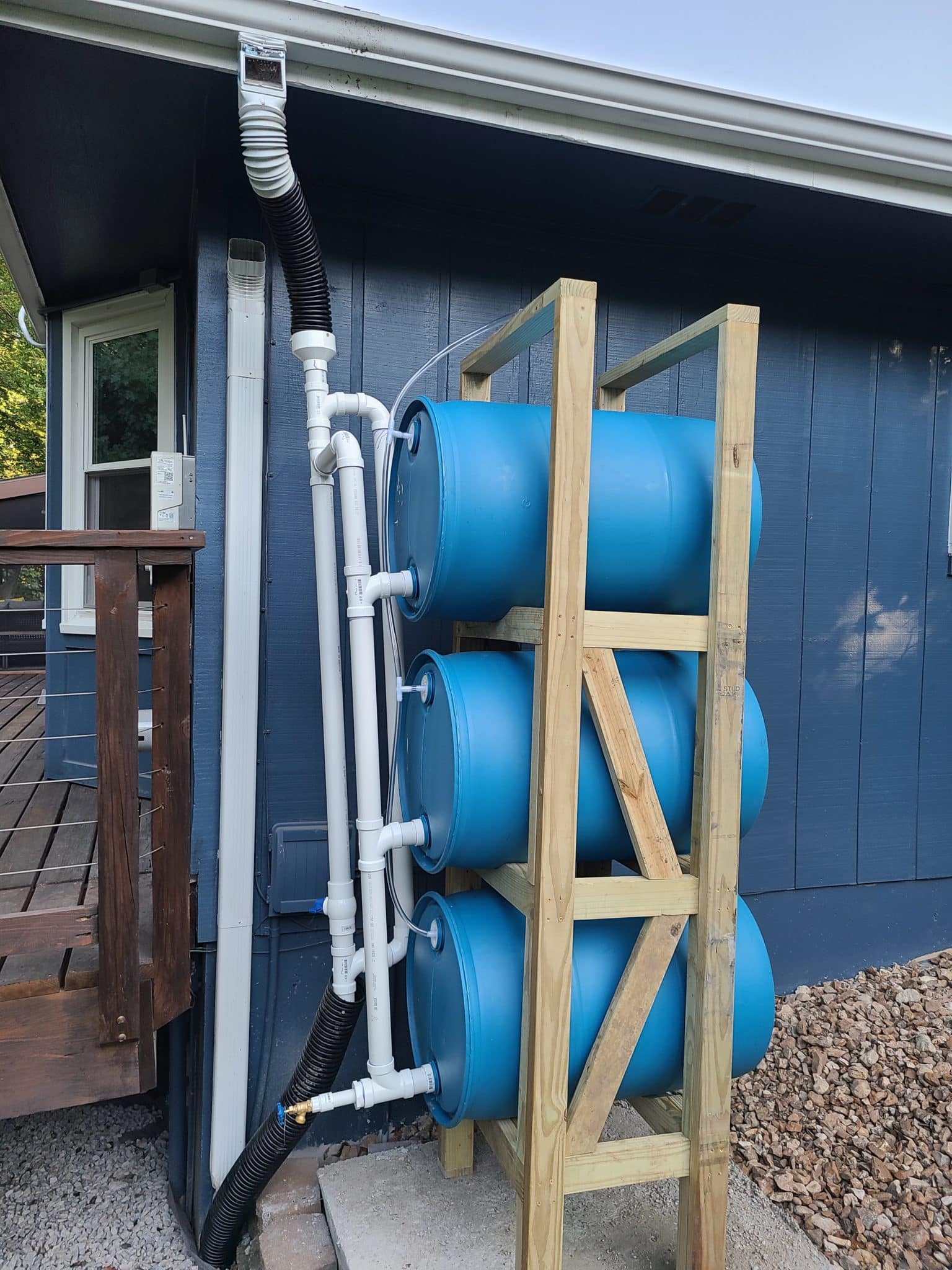 DIY stacked rain barrel system without decorative screen surrounding it