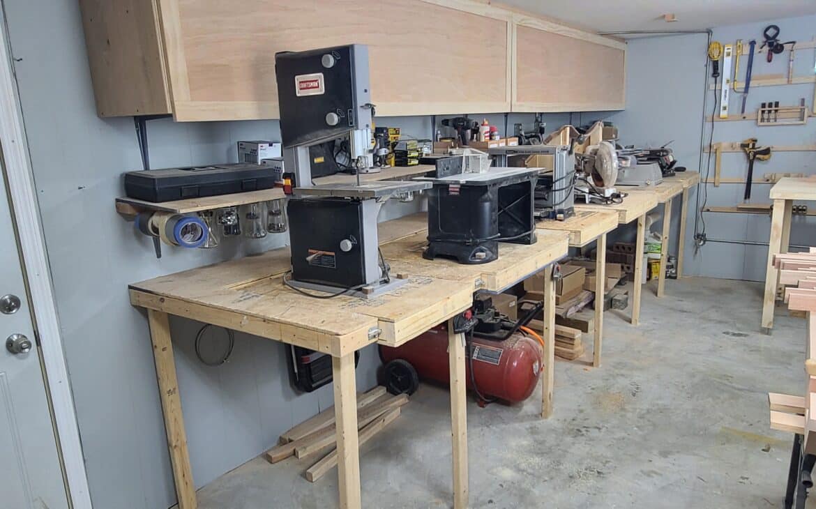 A series of large power tools mounted to a flipping workbench