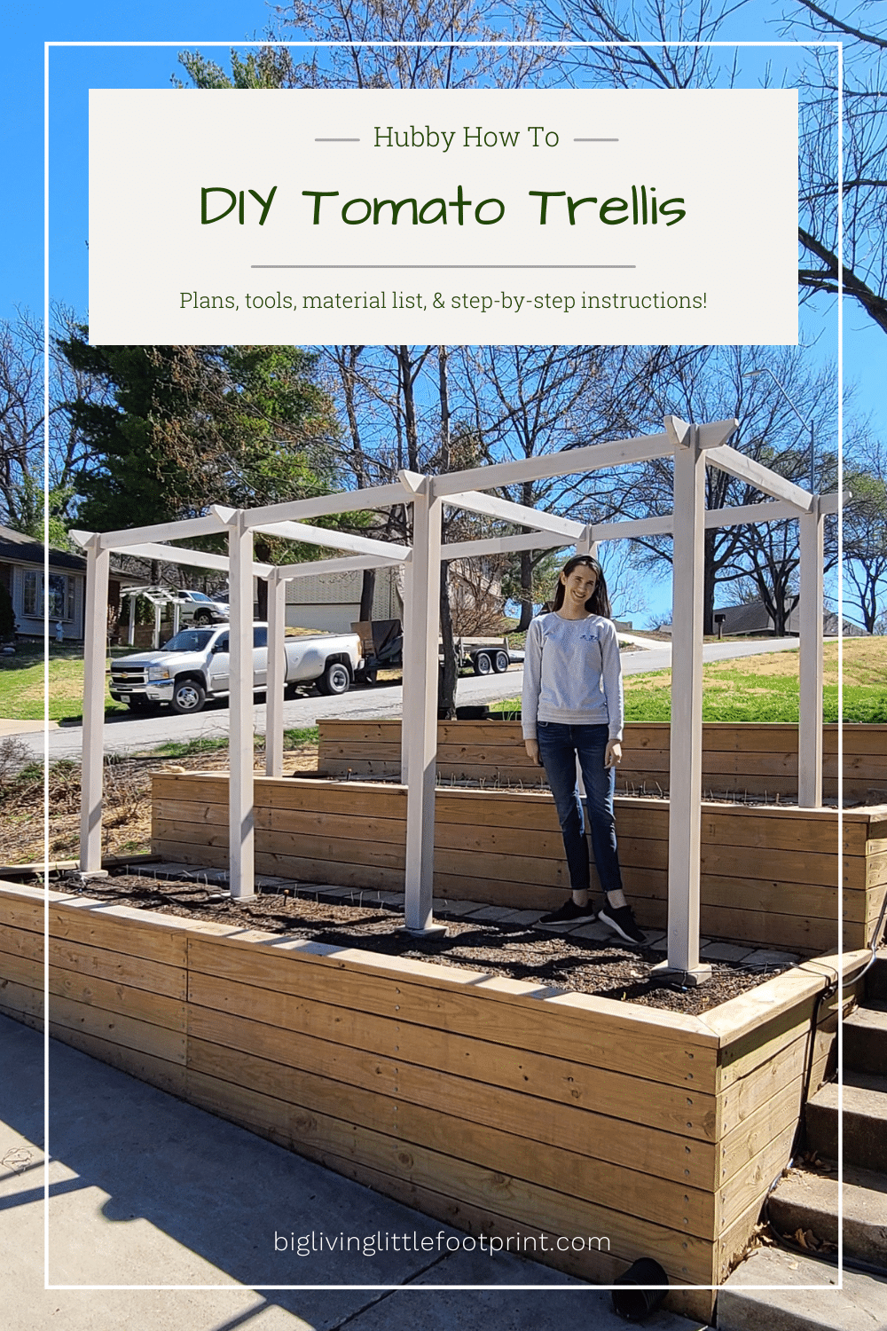 Woman standing on a terraced vegetable garden with DIY tomato trellis